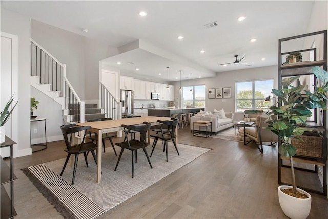 242 Estates Cir, College Station, TX 77840 - dining room with ceiling fan, wood finished floors, stairs, and recessed lighting