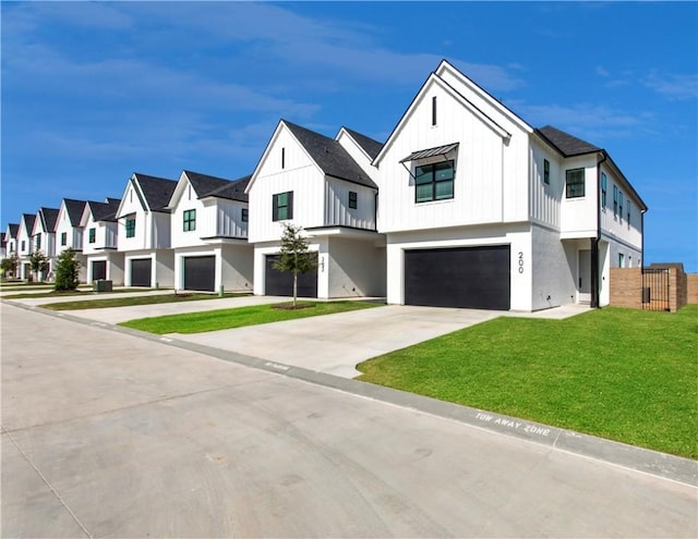 242 Estates Cir, College Station, TX 77840 - modern farmhouse with an attached garage, a residential view, driveway, a standing seam roof, and metal roof