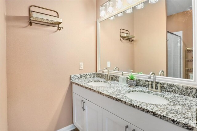 bathroom with vanity and an enclosed shower