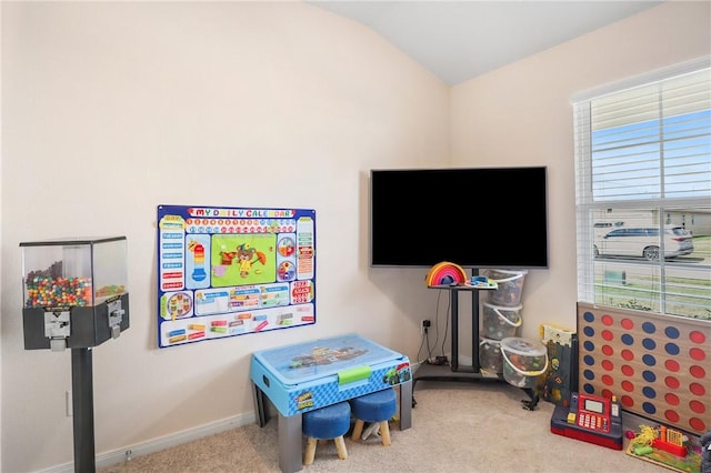 recreation room with light carpet and lofted ceiling