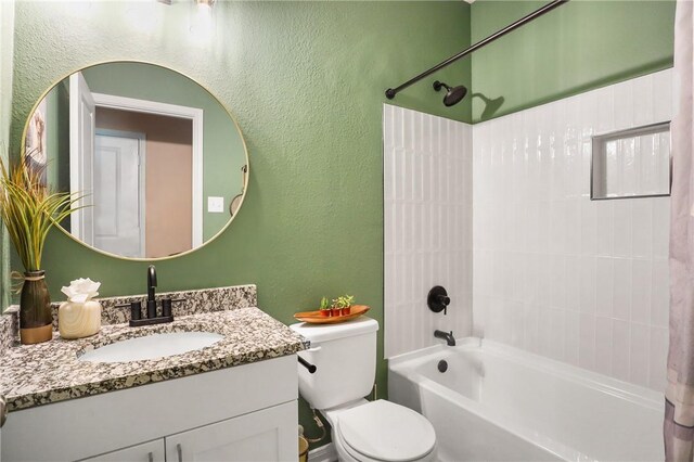 full bathroom featuring bathing tub / shower combination, vanity, and toilet