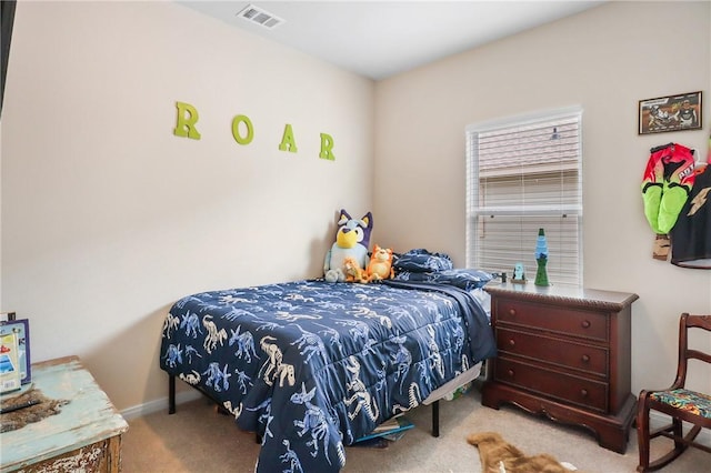 bedroom featuring light colored carpet