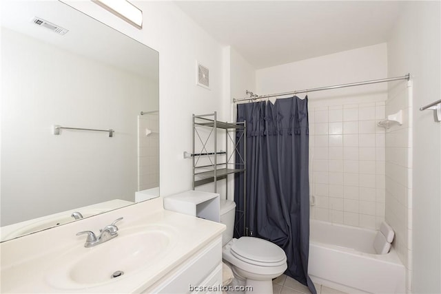 full bathroom with tile patterned flooring, shower / bath combo with shower curtain, vanity, and toilet