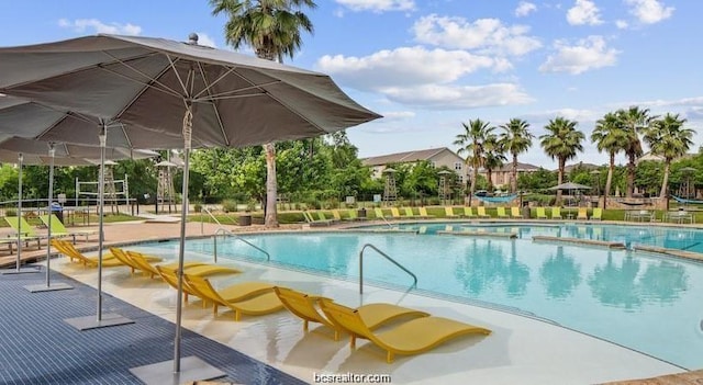 view of swimming pool with a patio area