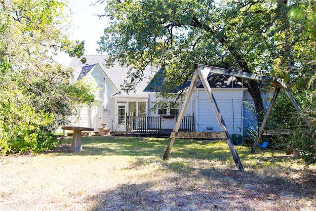 rear view of house featuring a deck