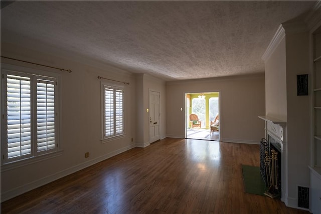 unfurnished living room with a textured ceiling and dark wood-type flooring