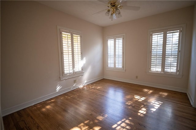 unfurnished room featuring ceiling fan and dark wood-type flooring