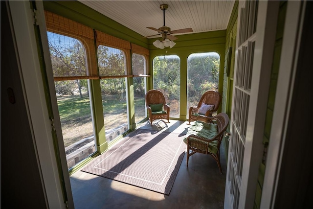 sunroom / solarium with ceiling fan and a wealth of natural light