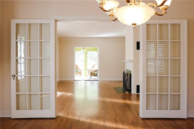 interior space with wood-type flooring and a notable chandelier