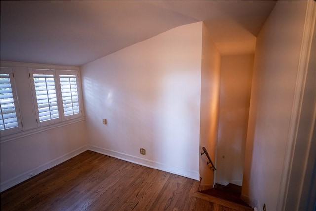 unfurnished room with dark hardwood / wood-style flooring