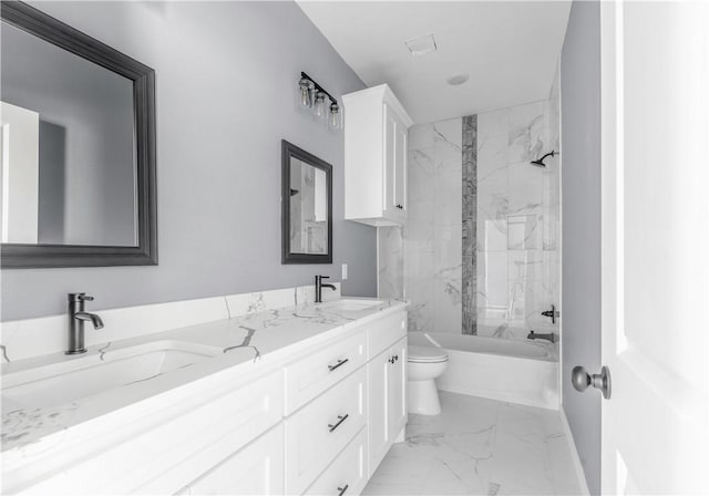 611 Levy St, Navasota, TX 77868 - full bath with marble finish floors, toilet, double vanity, washtub / shower combination, and baseboards
