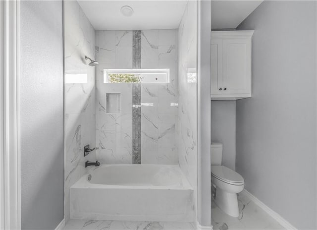 611 Levy St, Navasota, TX 77868 - full bath featuring marble look tiles, toilet, washtub / shower combination, and baseboards