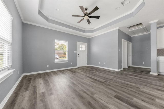 611 Levy St, Navasota, TX 77868 - unfurnished room with a tray ceiling, ceiling fan, wood finished floors, attic access, and ornamental molding