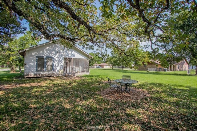 view of yard featuring a sunroom