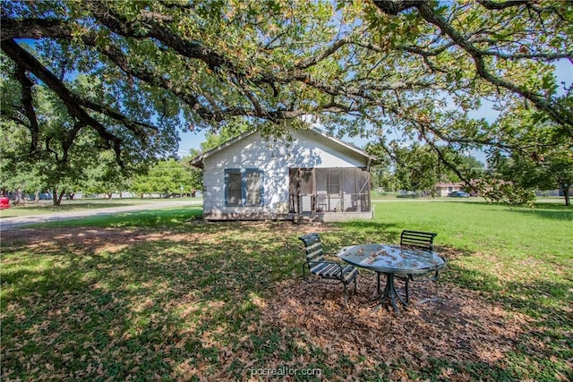 view of yard featuring a sunroom