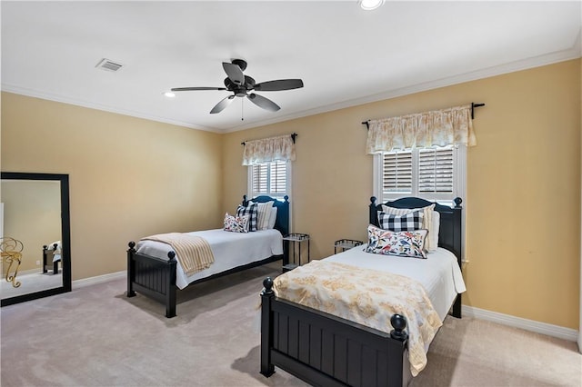 carpeted bedroom with crown molding and ceiling fan