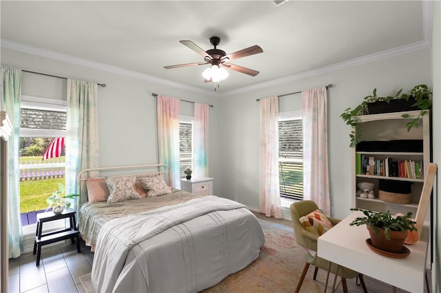 bedroom with ceiling fan and ornamental molding