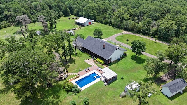 drone / aerial view featuring a view of trees