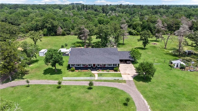 bird's eye view featuring a forest view