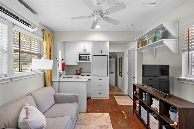 living room featuring ceiling fan and a wall mounted AC