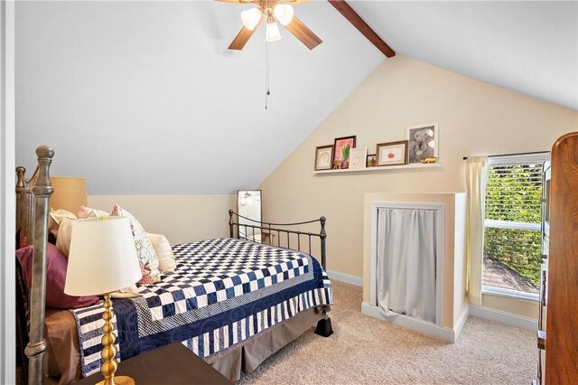 bedroom with baseboards, lofted ceiling with beams, carpet flooring, and a ceiling fan