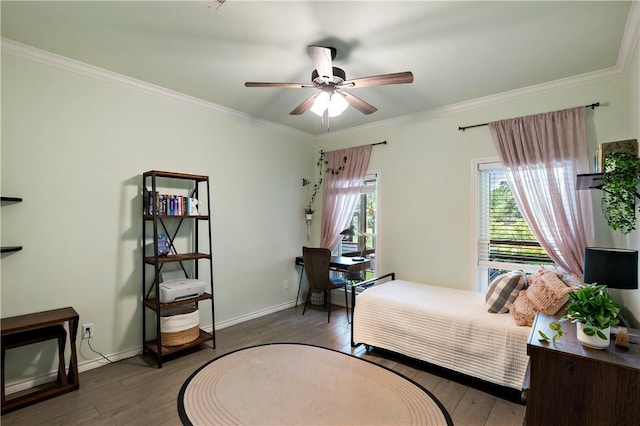 bedroom featuring ceiling fan, ornamental molding, baseboards, and hardwood / wood-style floors