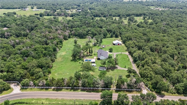 drone / aerial view featuring a view of trees
