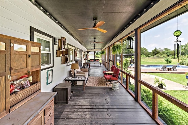 sunroom / solarium with ceiling fan