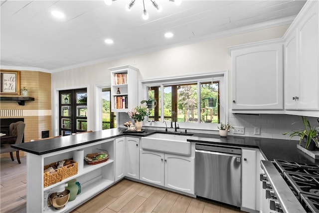 kitchen featuring open shelves, dark countertops, appliances with stainless steel finishes, and white cabinetry