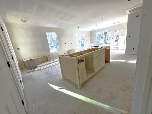 kitchen featuring a kitchen island and cream cabinetry