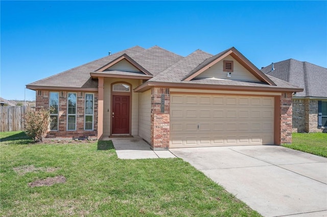 view of front facade with a front lawn, fence, concrete driveway, an attached garage, and brick siding