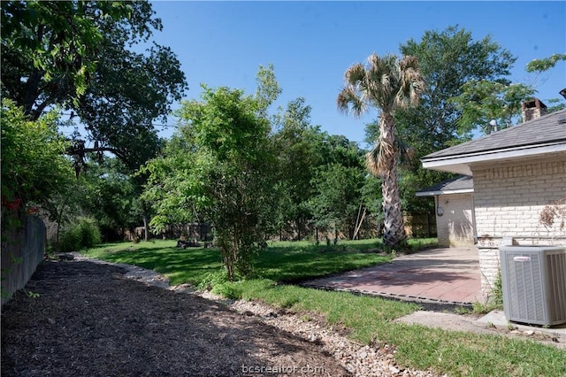 view of yard featuring a patio area and cooling unit