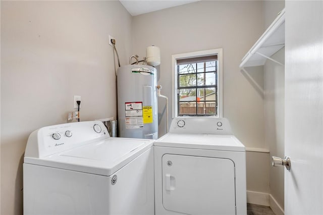 laundry room featuring washer and clothes dryer and water heater