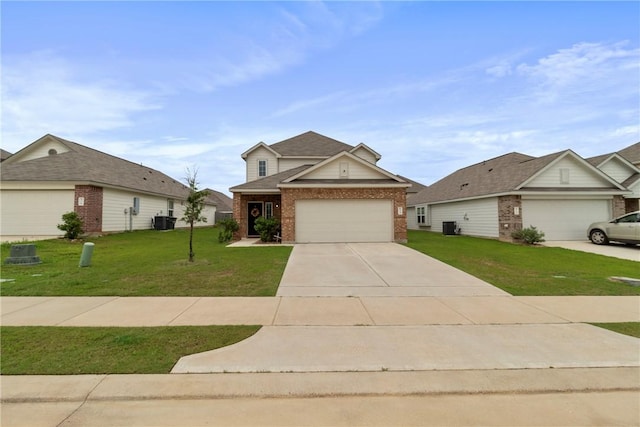 974 Marquis Dr, Bryan, TX 77803 - traditional home featuring brick siding, a front yard, and driveway