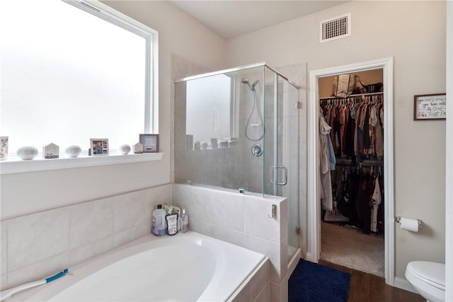 974 Marquis Dr, Bryan, TX 77803 - full bathroom with a garden tub, a stall shower, and a spacious closet