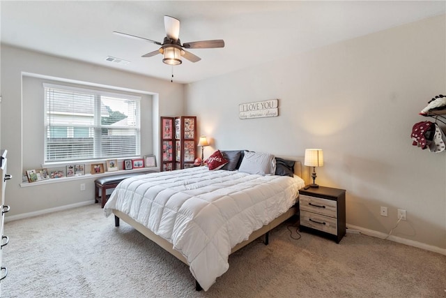 974 Marquis Dr, Bryan, TX 77803 - carpeted bedroom featuring baseboards and ceiling fan
