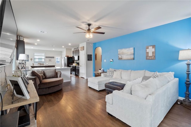 974 Marquis Dr, Bryan, TX 77803 - living area with arched walkways, a ceiling fan, dark wood finished floors, and recessed lighting