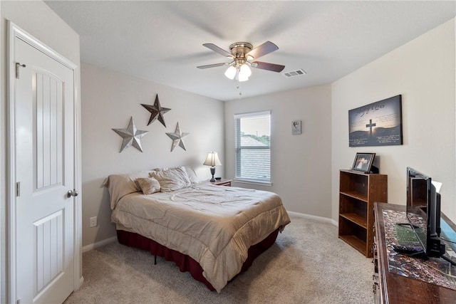 974 Marquis Dr, Bryan, TX 77803 - bedroom with light colored carpet and a ceiling fan