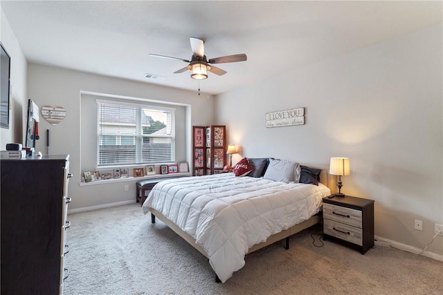 974 Marquis Dr, Bryan, TX 77803 - carpeted bedroom featuring baseboards and a ceiling fan