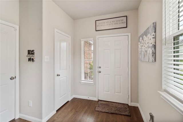 974 Marquis Dr, Bryan, TX 77803 - foyer entrance featuring dark wood-style floors and baseboards