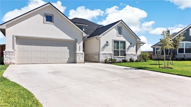 view of front of property featuring a garage and a front lawn