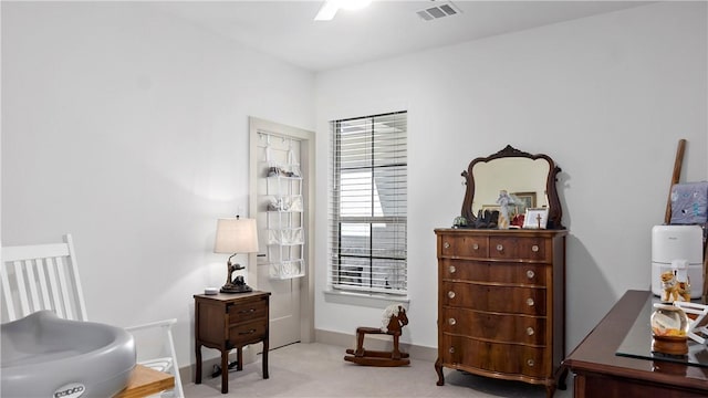 sitting room with light colored carpet