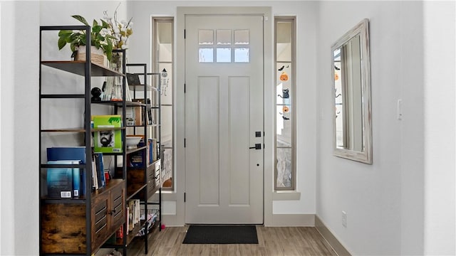 entrance foyer featuring hardwood / wood-style flooring