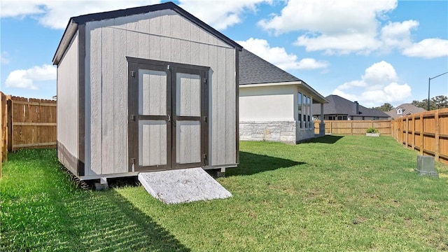 view of outbuilding featuring a yard