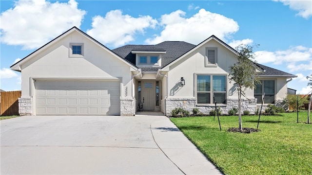 view of front facade featuring a front yard and a garage