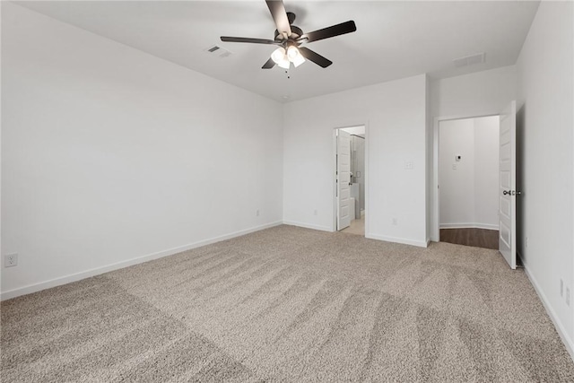 unfurnished bedroom featuring carpet floors, visible vents, ceiling fan, and baseboards