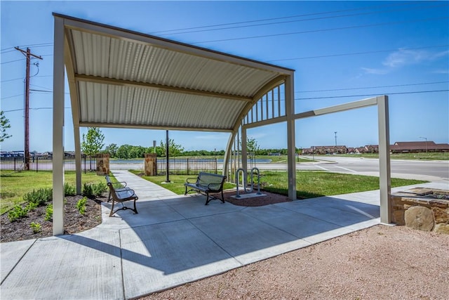 view of home's community featuring fence and a yard