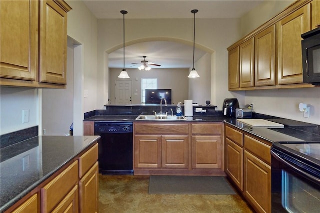 kitchen with decorative light fixtures, brown cabinetry, black appliances, a ceiling fan, and a sink