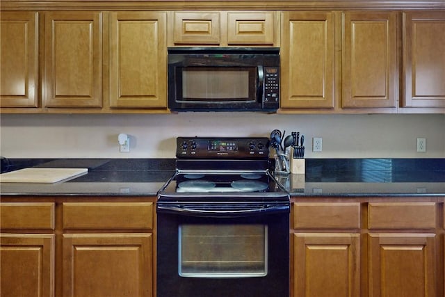 kitchen with black appliances and brown cabinetry