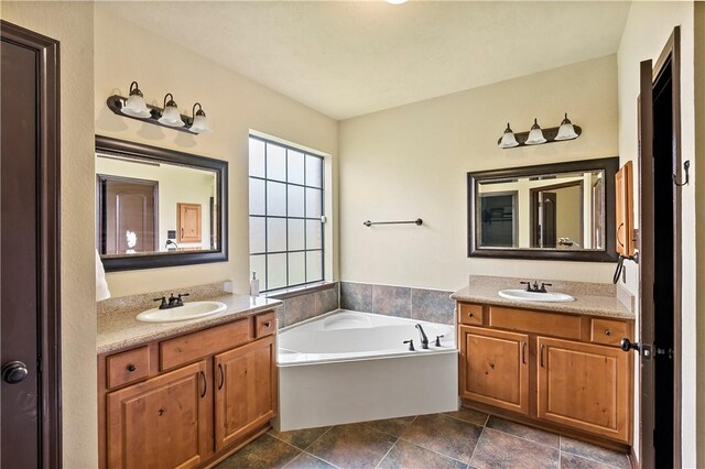 2409 Stone Castle Cir, College Station, TX 77845 - full bath featuring two vanities and a garden tub